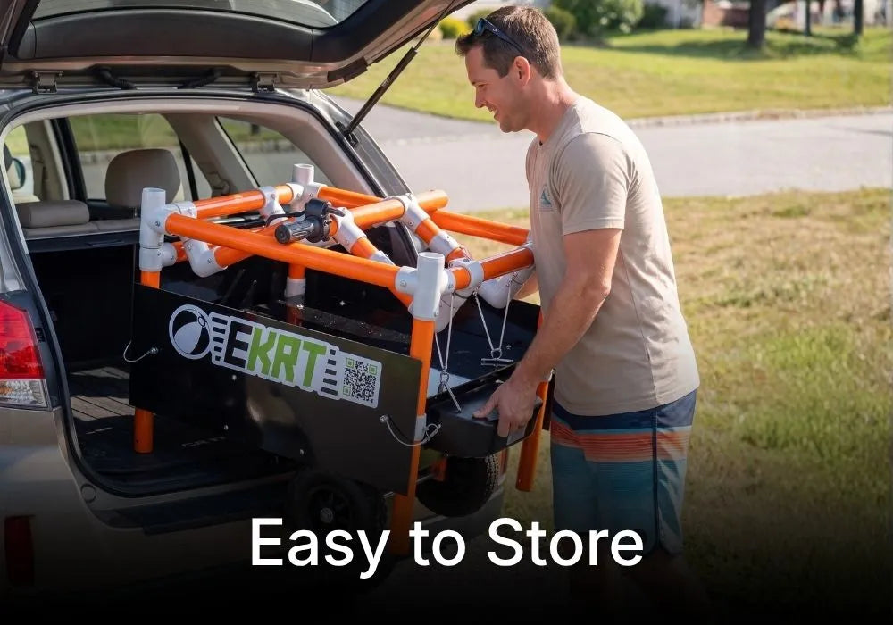 A man loading a black and orange electric beach e-KRT into the open trunk of a car outdoors.